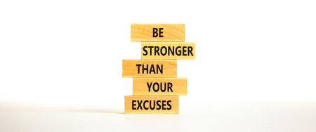 Be stronger symbol. Concept words Be stronger than your excuses on wooden blocks on a beautiful...
