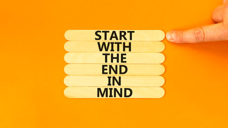 Start in end of mind symbol. Concept words Start with the end in mind on wooden stick. Beautiful...