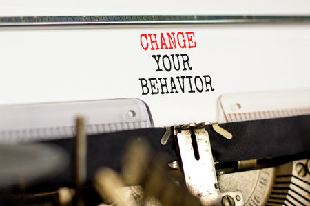 Motivation Change your behavior symbol. Concept words Change your behavior on white paper typed on old retro typewriter on beautiful white background. Business change your behavior concept. Copy spaceの写真素材
