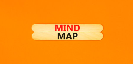 mind map symbol. Concept words Mind map on beautiful wooden stick on a beautiful orange table orange background. Business, support, motivation, psychological and mind map concept. copyspace.の写真素材