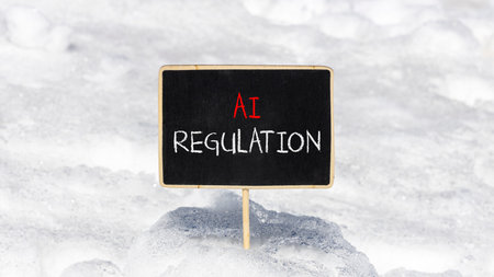 AI regulation symbol. Concept words AI artificial intelligence regulation on blackboard. beautiful snow background. Business AI artificial intelligence regulation concept. copy spaceの写真素材
