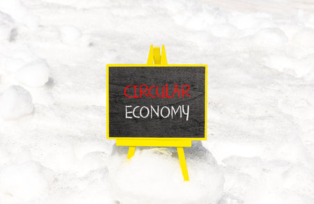 Circular economy symbol. Concept words Circular economy on beautiful black blackboard. beautiful snow background. business circular economy concept. copyspace.の写真素材