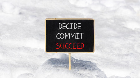 Decide commit succeed symbol. Concept word Decide Commit Succeed on beautiful black chalk blackboard. White snow. Beautiful white snow background. Business commit decide to succeed concept. Copy space.の写真素材