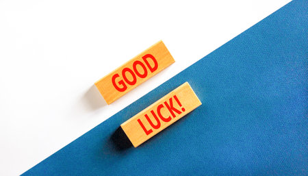 Good luck symbol. Concept words Good luck on beautiful wooden block. Beautiful white and blue background. Business, motivational good luck concept. Copy space.の写真素材