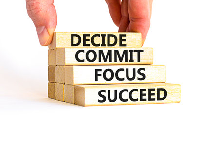 Decide commit focus succeed symbol. Concept word Decide Commit Focus Succeed on wooden block....