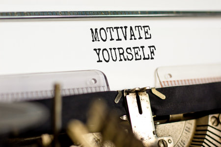 Motivate yourself symbol. Concept words Motivate yourself typed on beautiful old retro typewriter. Beautiful white paper background. Business psychology motivate yourself concept. Copy space.の写真素材