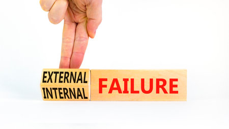 External or internal failure symbol. Concept words External failure or Internal failure on blocks. Beautiful white background. Businessman hand. Business external internal failure concept. Copy spaceの写真素材