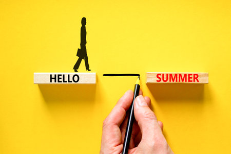 Hello summer symbol. Concept words Hello summer on beautiful wooden block. Businesswoman icon. Businessman hand. Beautiful yellow paper background. Business lifestyle Hello summer concept. Copy space.の写真素材