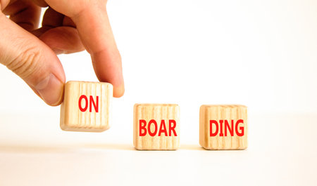 Onboarding success symbol. Concept word Onboarding on wooden blocks. Businessman hand. Beautiful...