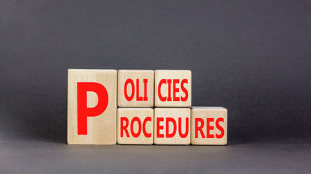 Policies and procedures symbol. Concept words Policies Procedures on beautiful wooden cubes....