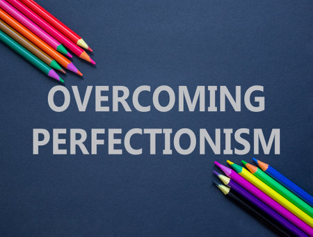 Overcoming perfectionism symbol. Concept words Overcoming perfectionism on beautiful black paper. Beautiful black background. Colored pencils. Business Overcoming perfectionism concept. Copy space.の写真素材