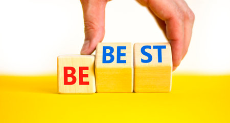 Motivational and inspirational be the best symbol. Concept words Be best on beautiful wooden block. Beautiful white background Businessman hand. Business motivational be best concept. Copy space.の写真素材