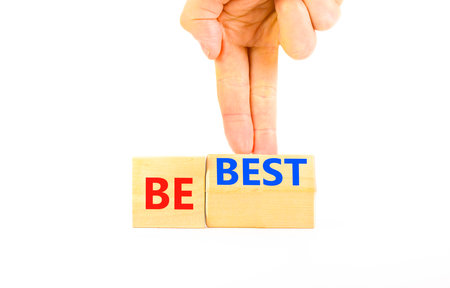 Motivational and inspirational be the best symbol. Concept words Be best on beautiful wooden block. Beautiful white background Businessman hand. Business motivational be best concept. Copy space.の写真素材