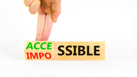 Accessible or impossible symbol. Concept words Accessible or Impossible on beautiful wooden blocks....