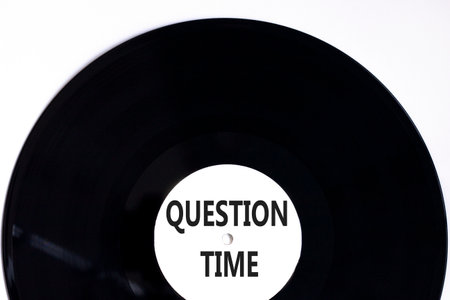 Question time symbol. Concept words Question time on beautiful white and black vinyl disk. Beautiful white background. Business and question time concept. Copy space.の写真素材