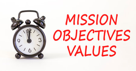 Mission values objectives symbol. Concept words Mission Objectives Values on beautiful white paper....
