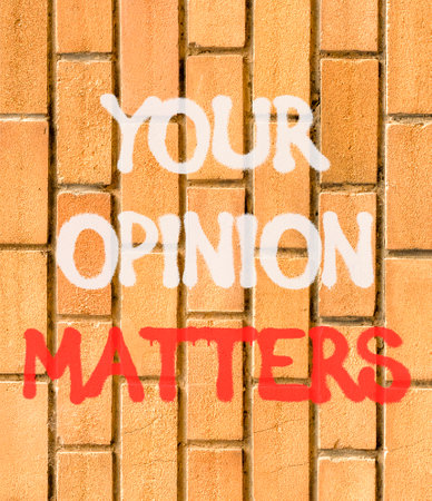 Your opinion matters symbol. Concept words Your opinion on beautiful brown brick wall. Beautiful brown brick wall background. Business your matters opinion concept. Copy space.の写真素材