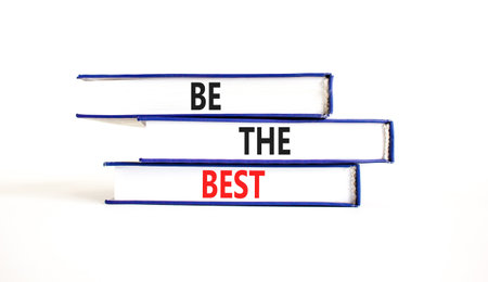 Motivational be the best symbol. Concept words Be the best on beautiful blue white books. Beautiful...
