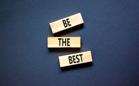 Motivational be the best symbol. Concept words Be the best on beautiful wooden blocks. Beautiful black table black background. Business motivational be the best concept. Copy space.の写真素材