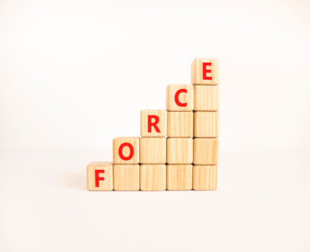 Force symbol. Concept word Force on beautiful wooden blocks. Beautiful white table white background. Business lifestyle force concept. Copy space.の写真素材