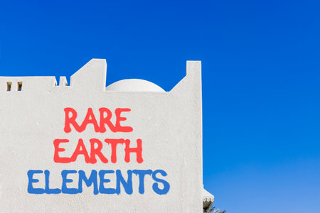 Rare earth elements symbol. Concept words Rare earth elements on beautiful white wall. Beautiful white wall blue sky background. Business and rare earth elements concept. Copy space.の写真素材