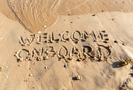 Business welcome onboard concept. Concept Welcome word onboard written on beautiful Red sea sand beach. Beautiful Red sea ocean sand beach background, copy space. Business welcome onboard concept.の写真素材