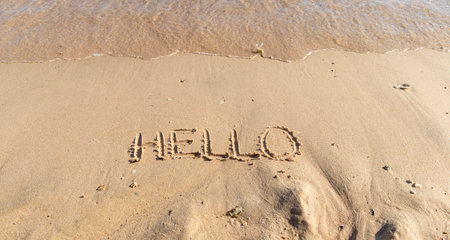 Business hello and welcome concept. Concept word Hello written on beautiful Red sea ocean sand beach. Beautiful Red sea ocean sand beach background, copy space. Business hello and welcome concept.の写真素材