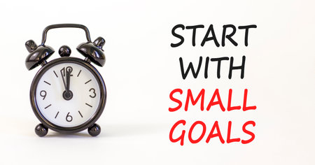 Start with small goals symbol. Concept words phrase Start with small goals on beautiful white paper....