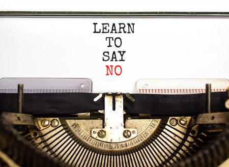 Learn to say no symbol. Concept words phrase Learn to say no typed on beautiful retro old typewriter. Beautiful white background. Business psychological Learn to say no concept. Copy space.の写真素材
