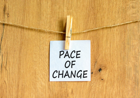 Pace of change symbol. Concept words Pace of change on beautiful white paper on clothespin....