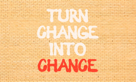 Turn change into chance symbol. Concept words phrase Turn change into chance on beautiful brown...