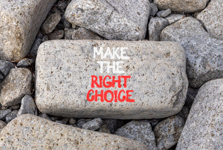 Make the right choice symbol. Concept words phrase Make the right choice on beautiful gray stone. Beautiful gray stone beach background. Business Make the right choice concept. Copy space.の写真素材