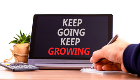 Keep going and growing symbol. Concept words phrase Keep going keep growing on beautiful tablet....