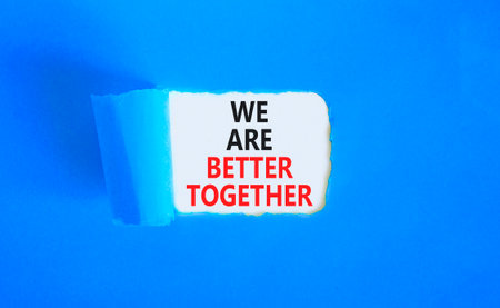 We are better together symbol. Concept words phrase We are better together on beautiful white paper. Beautiful blue paper background. Business We are better together concept. Copy space.の写真素材