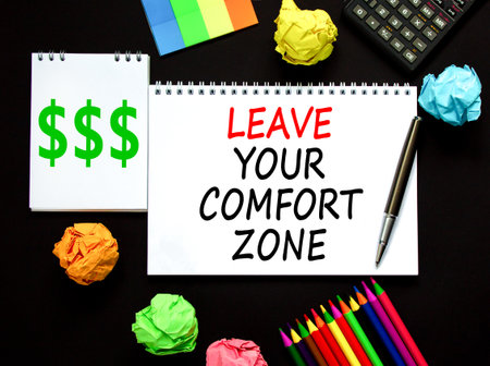 Leave your comfort zone symbol. Concept words Leave your comfort zone on beautiful white note. Beautiful black background. Business psychological Leave your comfort zone concept. Copy space.の写真素材