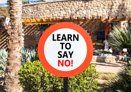 Learn to say no symbol. Concept words phrase Learn to say no on beautiful road sign. Beautiful palm tree background. Business psychological Learn to say no concept. Copy space.の写真素材