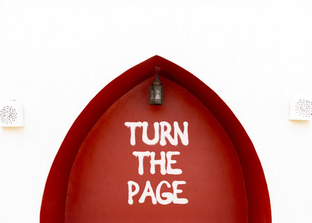 Turn the page symbol. Concept words Turn the page on beautiful white and red wall. Beautiful white and red wall background. Business motivational lifestyle turn the page concept. Copy space.の写真素材