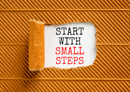Start with small steps symbol. Concept words phrase Start with small steps on beautiful white paper....