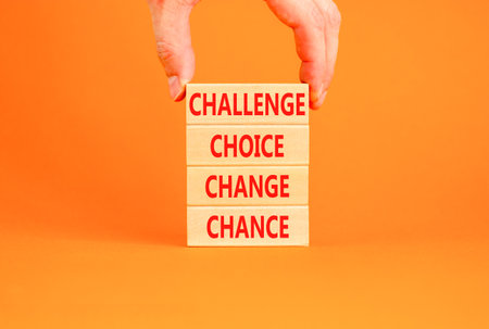 Challenge choice change chance symbol. Concept words Challenge choice change chance on beautiful wooden blocks. Beautiful orange background. Business Challenge choice change chance concept. Copy spaceの写真素材