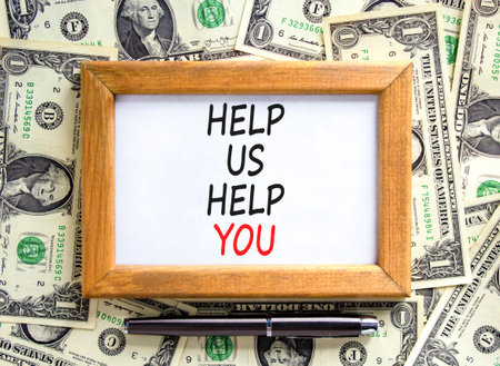 Help you symbol. Concept words phrase Help us help you on beautiful wooden picture frame. Dollar...