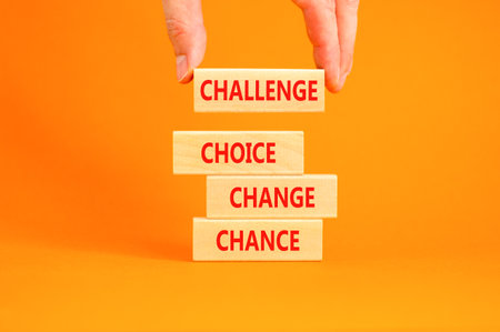 Challenge choice change chance symbol. Concept words Challenge choice change chance on beautiful wooden blocks. Beautiful orange background. Business Challenge choice change chance concept. Copy spaceの写真素材