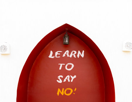 Learn to say no symbol. Concept words phrase Learn to say no on beautiful brown wall. Beautiful white wall background. Business psychological Learn to say no concept. Copy space.の写真素材