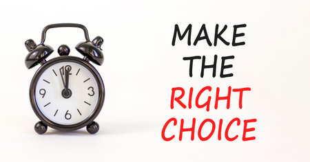 Make the right choice symbol. Concept words phrase Make the right choice on beautiful white paper. Black alarm clock. Beautiful white background. Business Make the right choice concept. Copy space.の写真素材