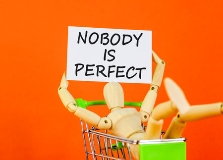 Nobody is perfect symbol. Concept words Nobody is perfect on beautiful white card. Beautiful orange background. Businessman model. Business motivational lifestyle nobody is perfect concept. Copy spaceの写真素材