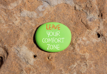 Leave your comfort zone symbol. Concept words Leave your comfort zone on beautiful green stone....