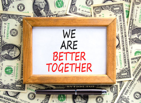 We are better together symbol. Concept words phrase We are better together on beautiful white paper. Dollar bills. Beautiful dollar bills background. Business We are better together concept Copy spaceの写真素材