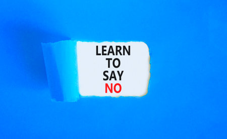 Learn to say no symbol. Concept words phrase Learn to say no on beautiful white paper. Beautiful blue paper background. Business psychological Learn to say no concept. Copy space.の写真素材