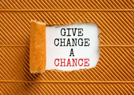 Give change a chance symbol. Concept words phrase Give change a chance on beautiful white paper. Beautiful brown paper background. Business Give change a chance concept. Copy space.の写真素材
