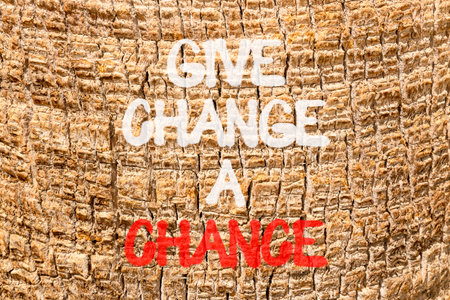 Give change a chance symbol. Concept words phrase Give change a chance on beautiful palm tree bark....