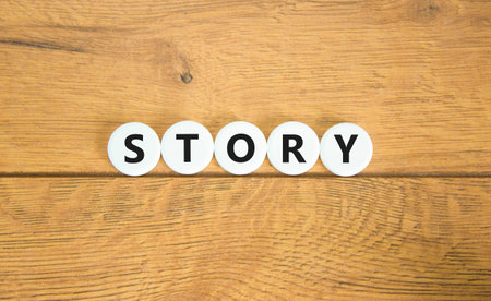 Story symbol. Concept word Story on beautiful white pills circles. Beautiful wooden table wooden background. Business lifestyle story concept. Copy space.の写真素材